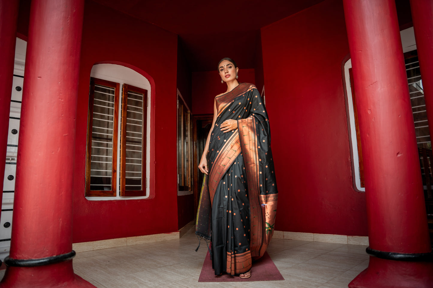 Rich black silk saree with madhubani painting