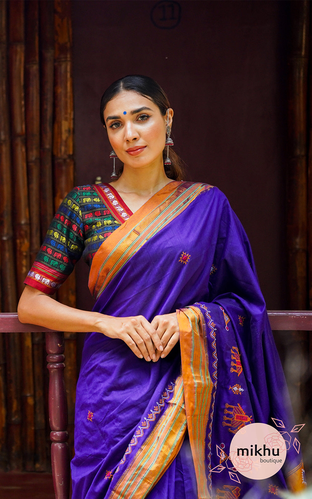 Violet saree golden orange border